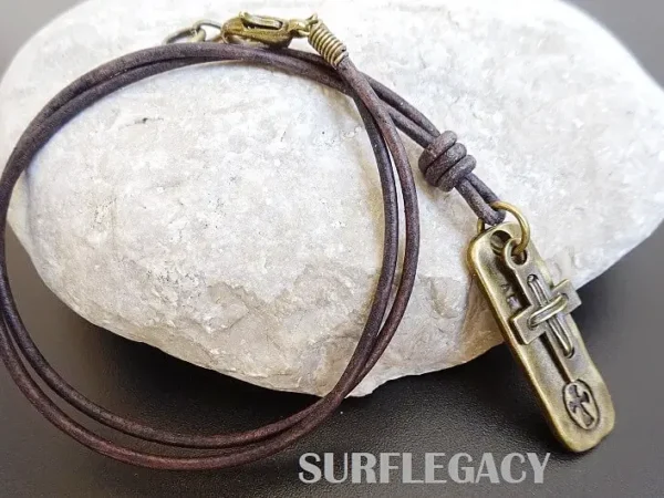 BURDEN-OF-PROOF MENS CROSS PENDANT ON LEATHER