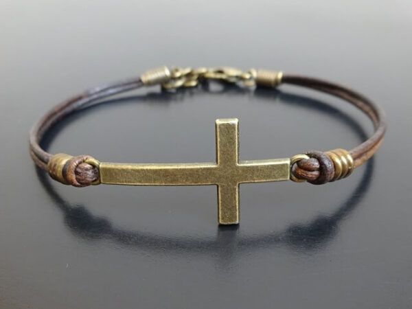 Cross charm bracelet on leather