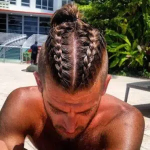 man with bun braids 