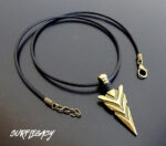 bronze arrowhead with black wrap