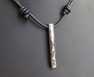 rune pendant with fehu, hagalaz and raidho runes